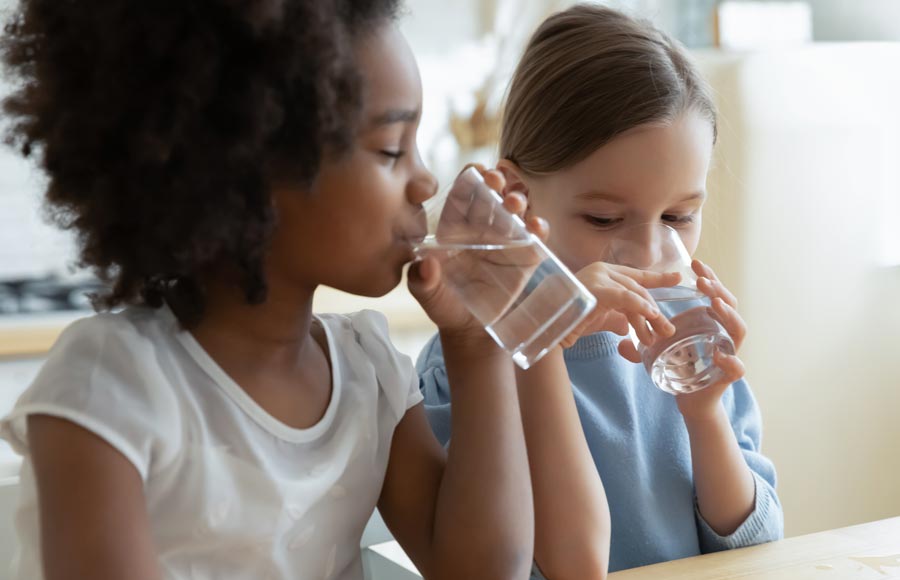 Girls Drinking Water Halo Water Filtration Denver